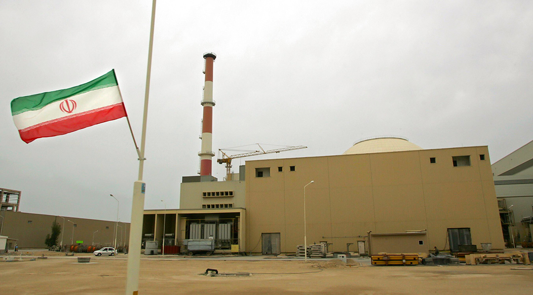 (FILES) An Iranian flag flies outside the building housing the reactor of the Bushehr nuclear power plant, in the Iranian port town of Bushehr, 1200 Kms south of Tehran, 03 April 2007.  Russia's Atomstroiexport corporation said 17 December 2007 that it had begun deliveries of nuclear fuel for Iran's first atomic power station at Bushehr. AFP PHOTO/BEHROUZ MEHRI (Photo credit should read BEHROUZ MEHRI/AFP/Getty Images)